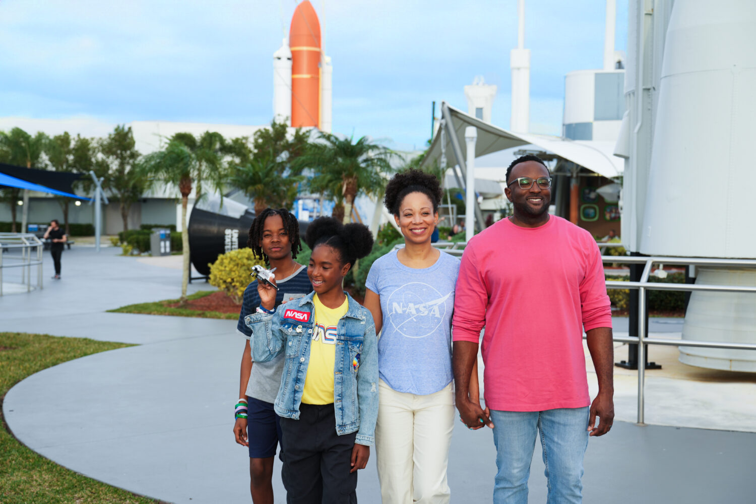 Family standing in Rocket Garden, looking up at the rockets.